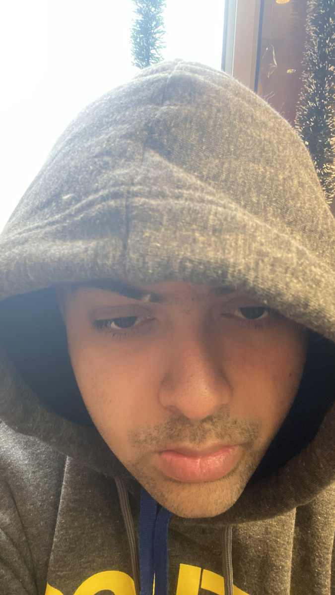 Close portrait of Rishit Kar in a hoodie